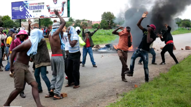 Protestors during a demonstration over the recent fuel price increase in the suburb of Warren Park, Harare. January 15, 2019. EPA Images